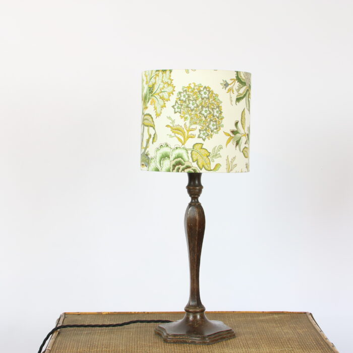 A table lamp with a green and yellow floral pattern.