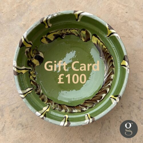 A green bowl with the words gift card £100.